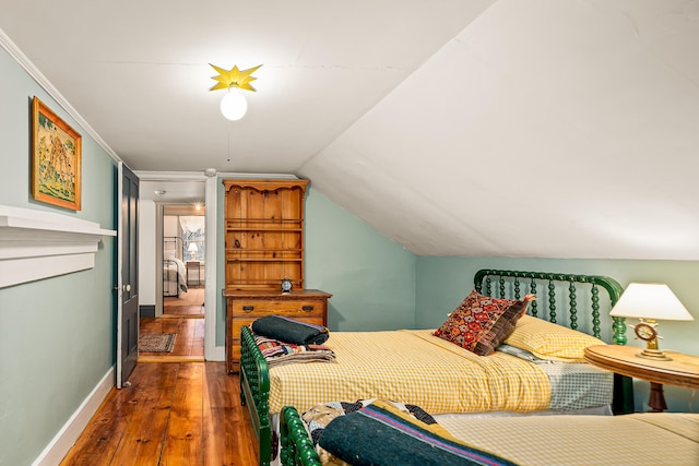 681 Sedgwick Ridge Rd, Sedgwick, ME 04676 - bedroom with hardwood / wood-style floors and vaulted ceiling