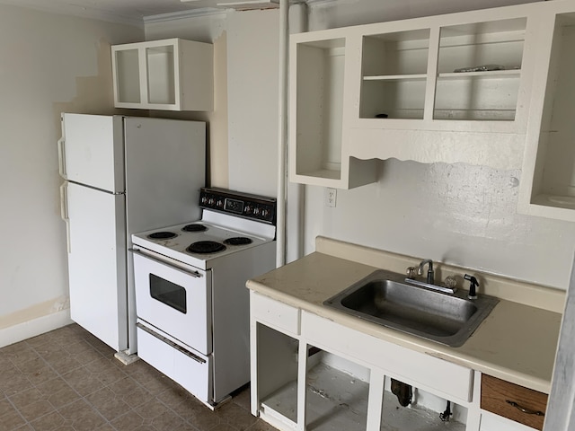 kitchen featuring crown molding, sink, and white appliances