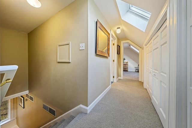 15 Brentwood Dr Unit 4, Cumberland, ME 04110 - hallway with light colored carpet, baseboards, vaulted ceiling with skylight, and visible vents