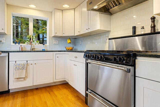 15 Brentwood Dr Unit 4, Cumberland, ME 04110 - kitchen featuring white cabinets, stove, backsplash, dishwasher, and custom exhaust hood