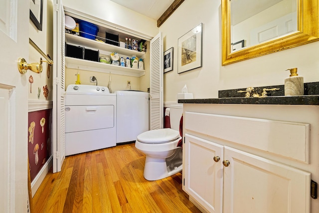 15 Brentwood Dr Unit 4, Cumberland, ME 04110 - bathroom with washing machine and clothes dryer, toilet, wood finished floors, and vanity