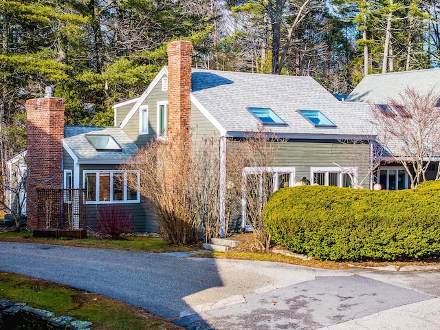 15 Brentwood Dr Unit 4, Cumberland, ME 04110 - view of front of house with a chimney and a shingled roof