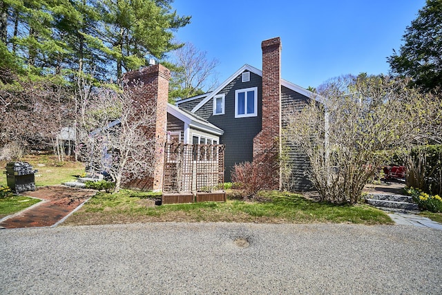 15 Brentwood Dr Unit 4, Cumberland, ME 04110 - view of side of property featuring a chimney
