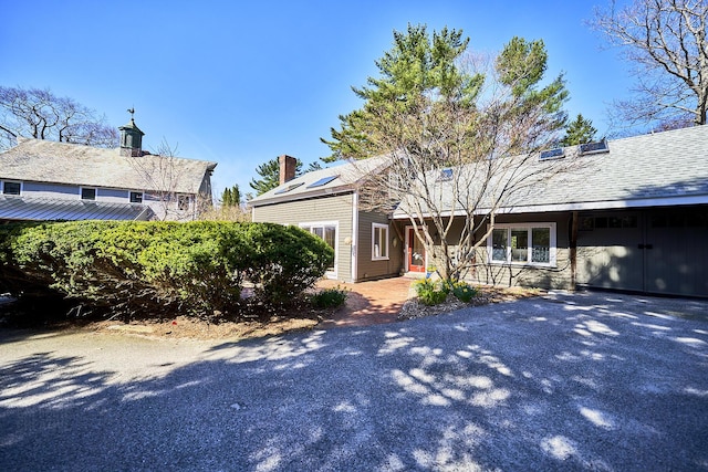 15 Brentwood Dr Unit 4, Cumberland, ME 04110 - view of front of house featuring a chimney and aphalt driveway