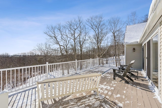 view of snow covered deck