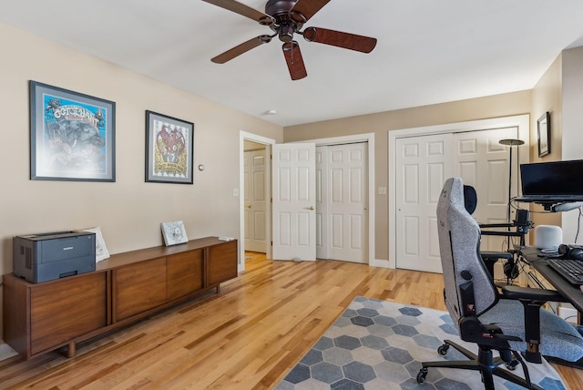 office area with ceiling fan and light wood-type flooring