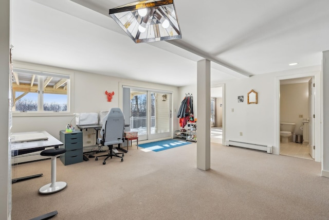 office space featuring carpet flooring and a baseboard heating unit