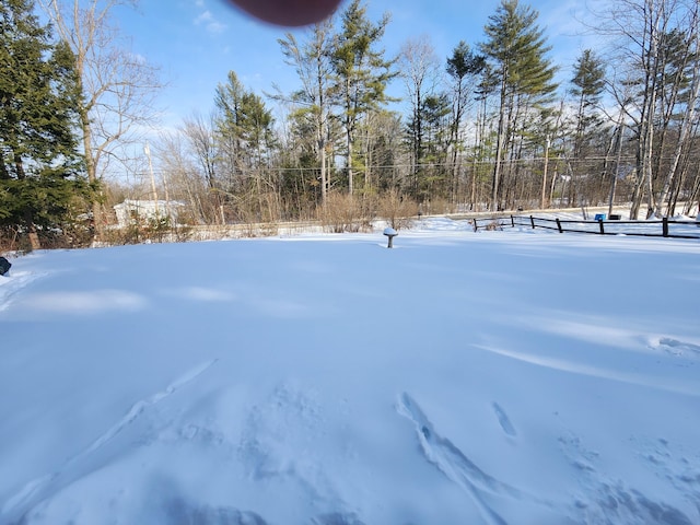 view of yard layered in snow