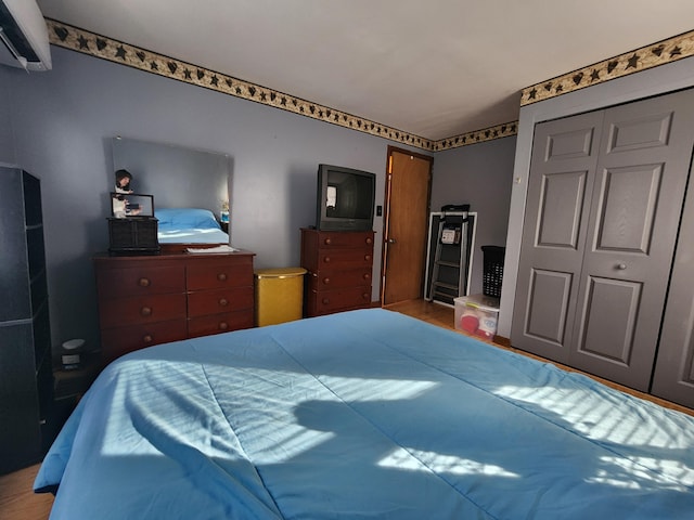 bedroom with a wall mounted AC