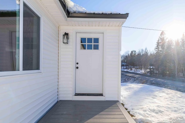 view of snow covered property entrance