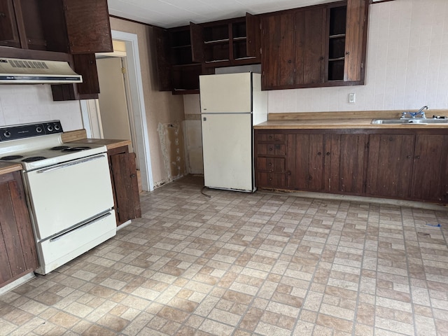 kitchen with dark brown cabinetry, sink, white appliances, and ventilation hood