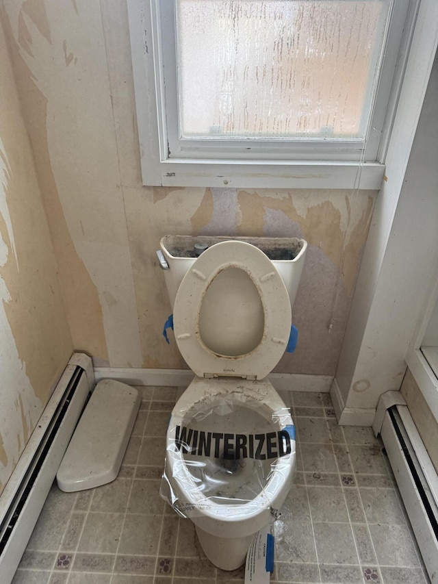 bathroom featuring toilet and a baseboard radiator