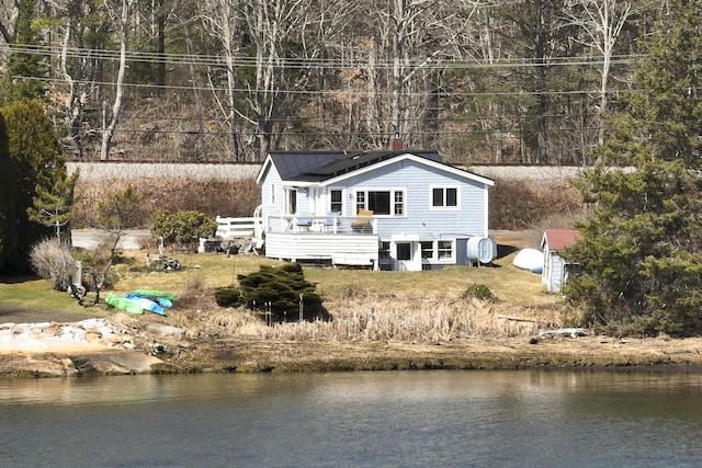 283 Mills Rd, Newcastle, ME 04553 - back of house featuring metal roof and a deck with water view