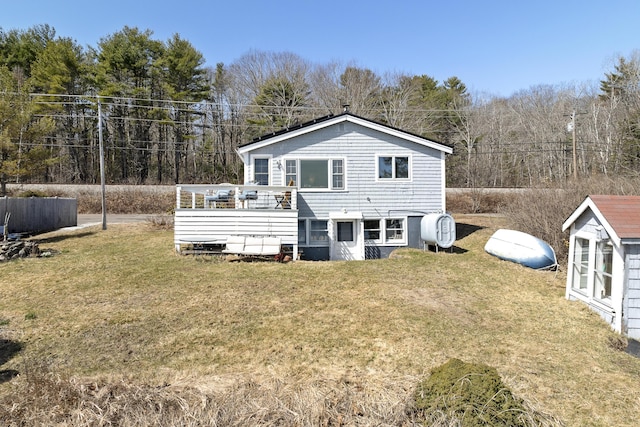 283 Mills Rd, Newcastle, ME 04553 - back of house with a yard, a wooden deck, and an outbuilding