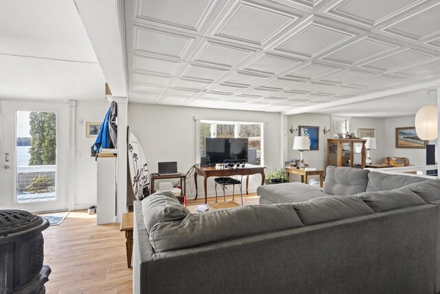 283 Mills Rd, Newcastle, ME 04553 - living room featuring light wood-type flooring and an ornate ceiling