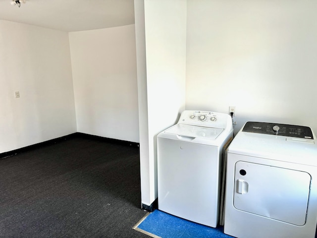 clothes washing area featuring separate washer and dryer and dark carpet