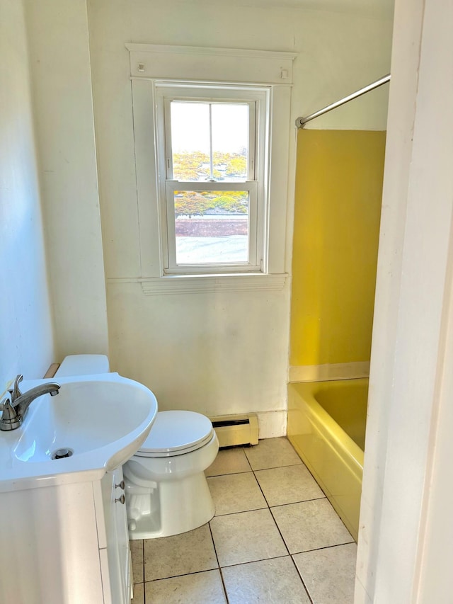 bathroom featuring tile patterned floors, toilet, and a baseboard heating unit