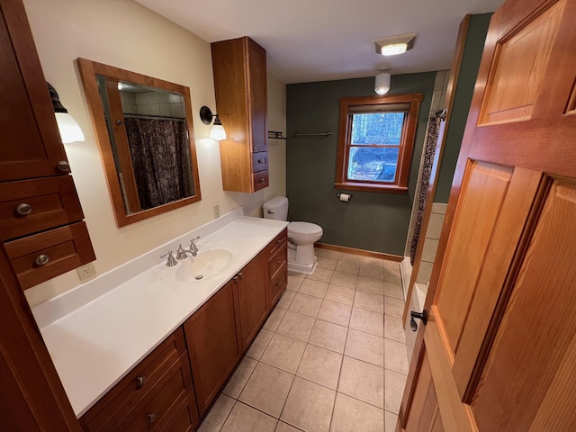 bathroom with tile patterned flooring, a shower with curtain, vanity, and toilet