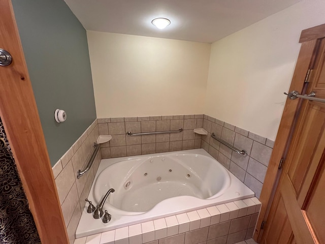 bathroom featuring tiled bath