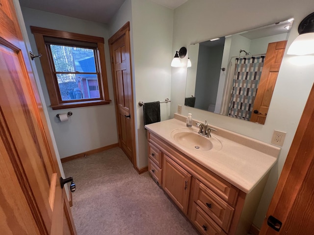 bathroom featuring a shower with curtain and vanity