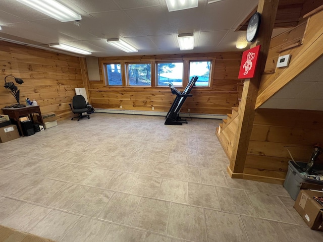 exercise room featuring wooden walls