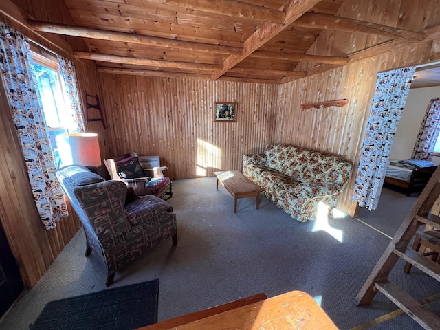 living room with lofted ceiling with beams, wooden walls, carpet floors, and wood ceiling