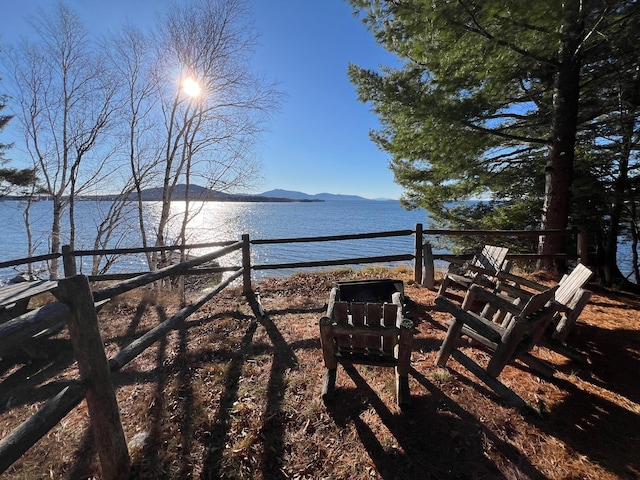 view of yard with a water and mountain view