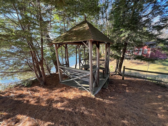 exterior space with a gazebo and a water view