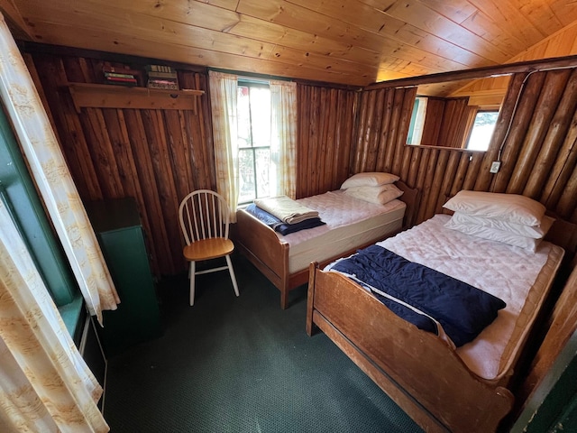 carpeted bedroom featuring wood walls and wood ceiling