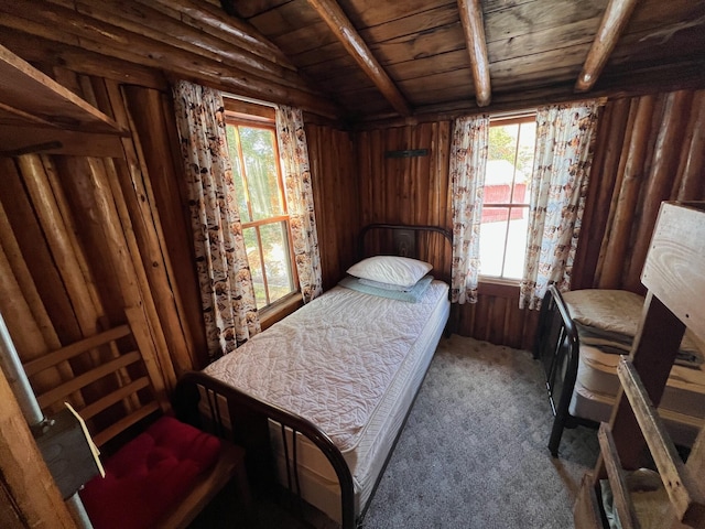 bedroom featuring carpet flooring, lofted ceiling with beams, wooden ceiling, and wood walls