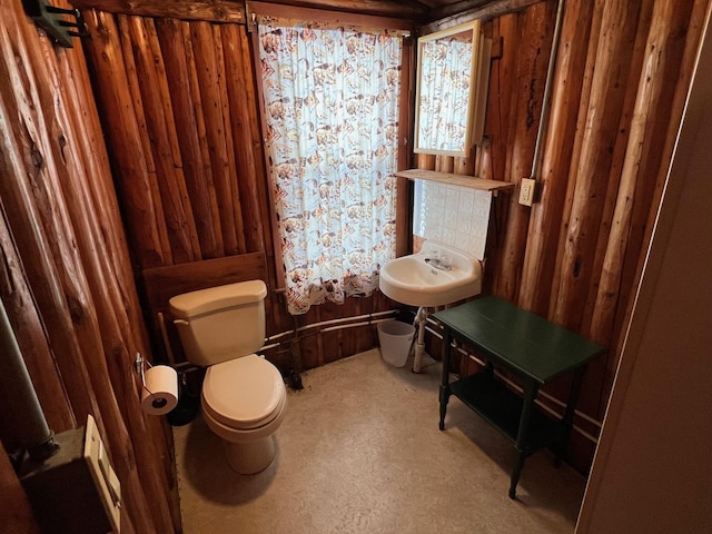 bathroom with toilet and sink