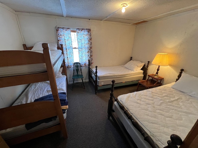 bedroom with carpet flooring and a textured ceiling