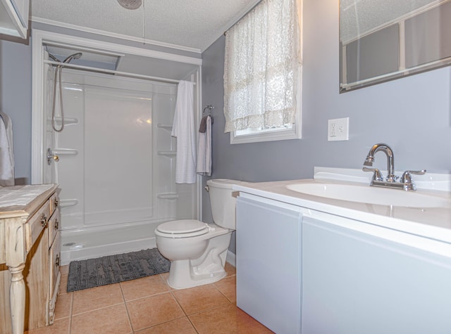 bathroom featuring vanity, a shower, tile patterned flooring, toilet, and a textured ceiling