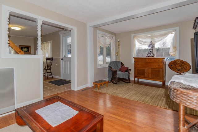 interior space featuring hardwood / wood-style floors, plenty of natural light, and a textured ceiling