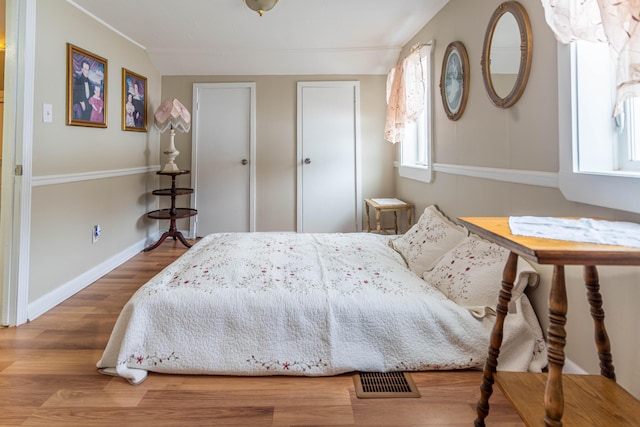 bedroom with wood-type flooring