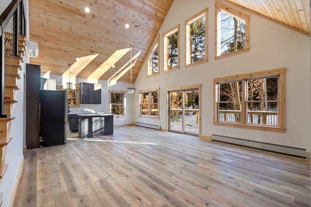 unfurnished living room featuring wooden ceiling, baseboard heating, and light wood finished floors