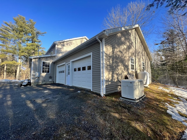 view of side of property featuring a garage