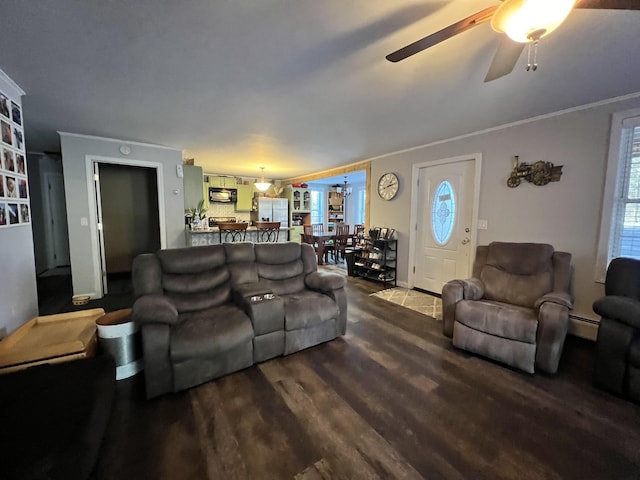 701 Stetson Rd, Exeter, ME 04435 - living area with ceiling fan, dark wood-style flooring, crown molding, and baseboard heating