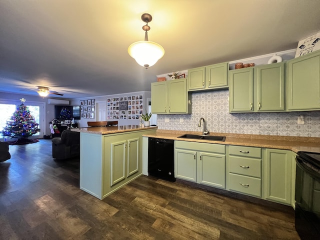 kitchen with hanging light fixtures, black appliances, dark hardwood / wood-style floors, and green cabinetry