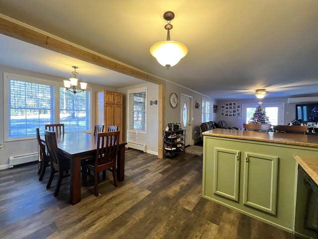701 Stetson Rd, Exeter, ME 04435 - dining room featuring a baseboard heating unit, dark wood-style flooring, a chandelier, a ceiling fan, and ornamental molding