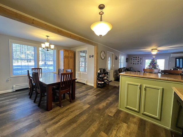 701 Stetson Rd, Exeter, ME 04435 - dining area with a baseboard radiator, dark wood-style flooring, a chandelier, and crown molding
