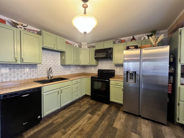 701 Stetson Rd, Exeter, ME 04435 - kitchen with black appliances, green cabinetry, dark wood-style flooring, backsplash, and decorative light fixtures