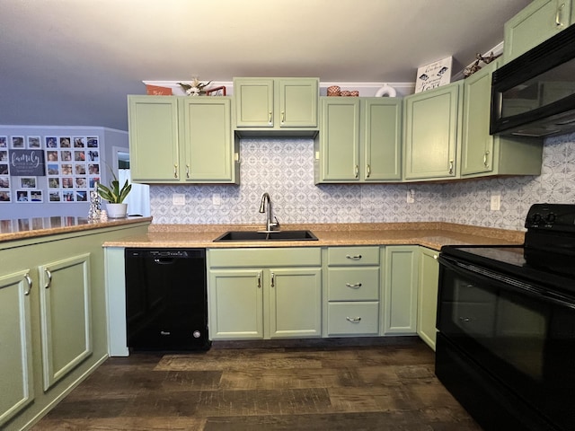 kitchen featuring sink, dark wood-type flooring, green cabinets, backsplash, and black appliances