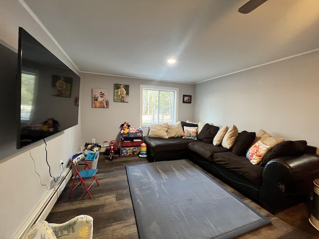 701 Stetson Rd, Exeter, ME 04435 - living room with a baseboard heating unit, wood finished floors, and crown molding