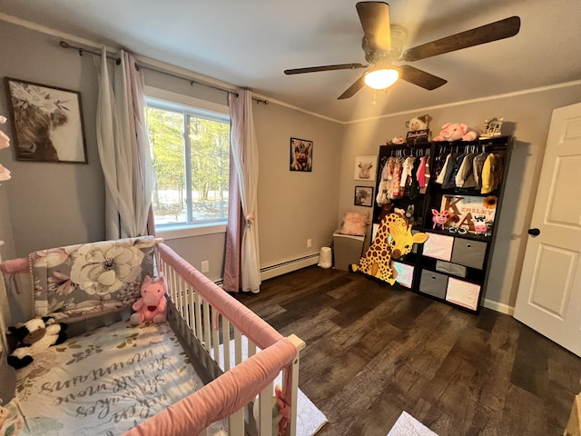 701 Stetson Rd, Exeter, ME 04435 - bedroom featuring wood finished floors, a ceiling fan, and a baseboard heating unit