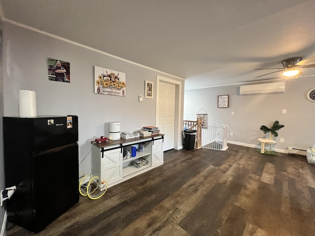 701 Stetson Rd, Exeter, ME 04435 - living room with a wall mounted AC, dark wood-type flooring, a baseboard radiator, and ceiling fan