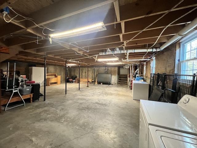 basement featuring washer and clothes dryer