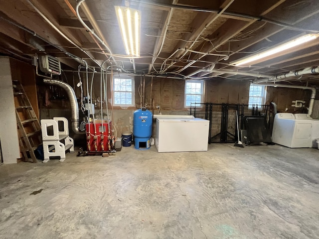701 Stetson Rd, Exeter, ME 04435 - basement with fridge, washing machine and clothes dryer, a water pressure tank, and a heating unit