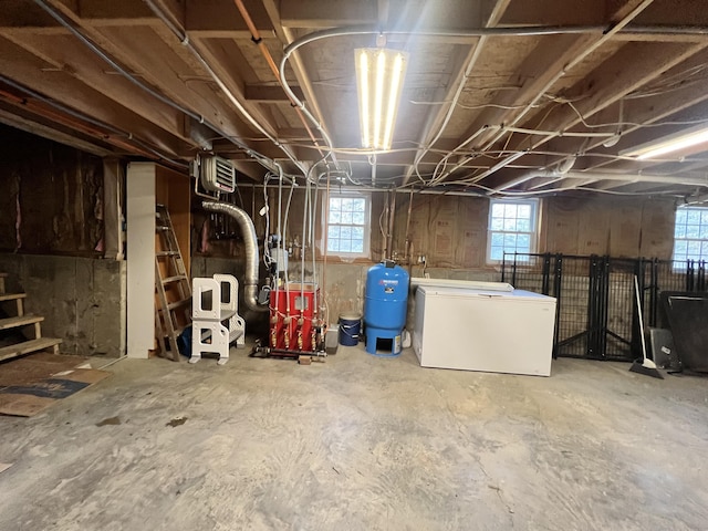 701 Stetson Rd, Exeter, ME 04435 - basement featuring fridge and a water pressure tank