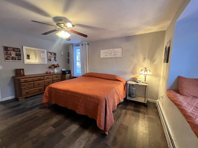 701 Stetson Rd, Exeter, ME 04435 - bedroom featuring a baseboard heating unit, dark wood-type flooring, and ceiling fan